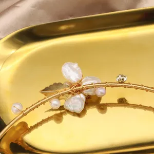 Handmade baroque pearl choker necklace featuring gold wire and leaf design chic jewelry