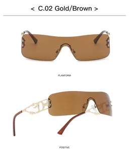 Y2K retro rahmenlose Sonnenbrille mit braunen Verlaufsgläsern und goldnen Flammenbügeln.