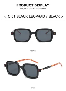 Details of stylish square frame sunglasses with black front and tortoiseshell temples.