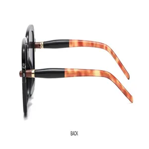 Detailed side view of stylish square sunglasses featuring tortoiseshell temples and hinges.