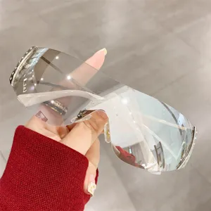 Y2K futuristic shield sunglasses for women, oversized gradient lens fashion eyewear trend.