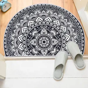 Close-up detail of the black and white Bohemian half-circle doormat with anti-slip backing.