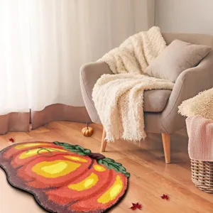 Cozy autumn pumpkin shaped soft floor mat detail view in warm living room setting.