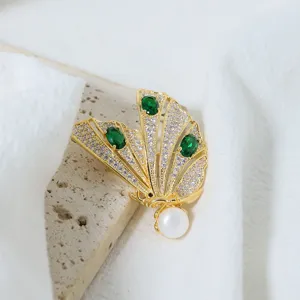 Elegant gold butterfly brooch with micro-set zircon and pearl for stylish women wear