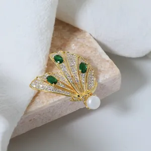 Exquisite gold-plated butterfly brooch with sparkling zircon, green stones and pearl.