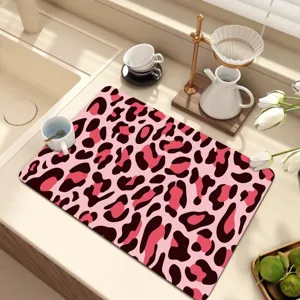 Pink leopard print diatomite kitchen drying mat, non-slip absorbent counter mat for home use.