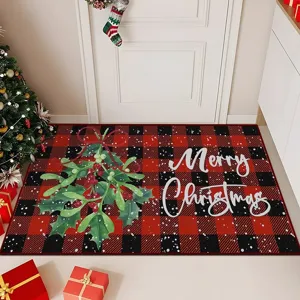Christmas doormat detail showing red black plaid pattern with mistletoe and holiday text.