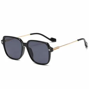 Stylish large frame square sunglasses with black acetate frame and gold metal temples.