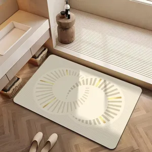 Vue détaillée du tapis de bain en terre de diatomée de luxe français au design doré chic.