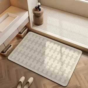 Vue de détail du tapis de bain antidérapant en terre de diatomées avec motif de vagues.