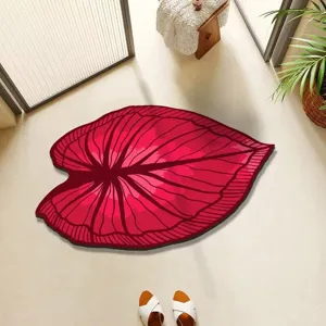 Detailed top view shot of the red leaf-shaped bathroom floor mat featuring clear vein textures.