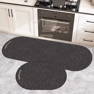 Kitchen anti-slip absorbent floor mat detail showing dark grey speckled two-piece rug set.