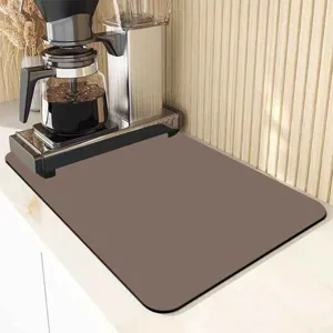 Absorbent coffee maker mat for kitchen countertop, non-slip rubber backing, easy to clean.