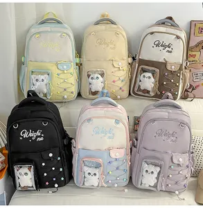 Colorful canvas school backpack with clear front pocket and cute cat plush, large capacity.