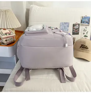 Detailed view of the stylish purple school backpack with transparent window and colorful cords.
