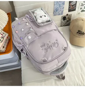 Detailed view of the stylish lavender school backpack with cute front clear pocket and embroidery.