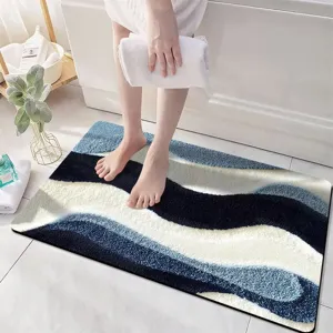 Detailed view of the wave patterned absorbent bath mat showing its soft 3d velvet texture.