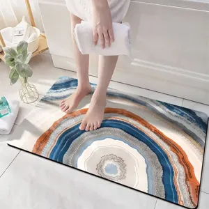 Absorbent diatomite bath mat with modern abstract agate slice pattern for home bathroom floors.