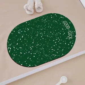 Oval green bathroom floor mat with white speckles and good luck print, modern anti-slip rug.