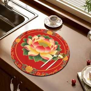 Round diatomaceous earth drying mat with beautiful Chinese lotus pattern for kitchen counter decor.