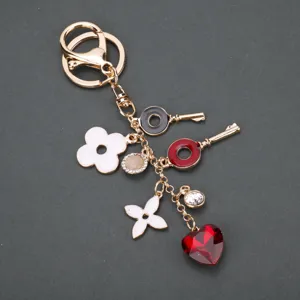 Portachiavi a Forma di Cuore e Trifoglio a Quattro Foglie Lusso Leggero Lega Placcata Oro Ciondolo Borsa Moda Carino Anello Chiave Regalo per Donna