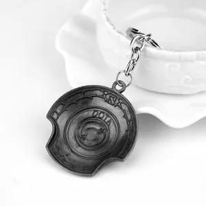Metall Legierung Spiel Schlüsselanhänger Detail, graviertes Symbol und DOTA Text, stabiler Ring.