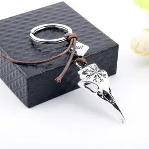 Close-up of Viking raven skull keychain featuring detailed Vegvisir rune engraving