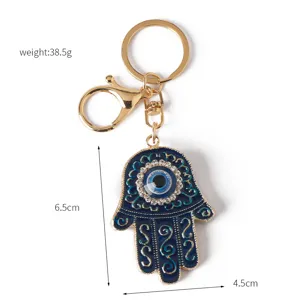 Detailed view of the Hamsa Hand keychain showing its specific dimensions and weight data.