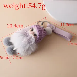 Detailed view of a cute sleeping baby plush keychain featuring precise dimension markings