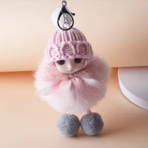 Cute pink plush doll keychain featuring a knitted hat lace bow and soft faux fur pompom