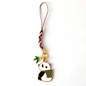 Detail view of cute panda charm with colorful braided strap and bamboo leaf accessory