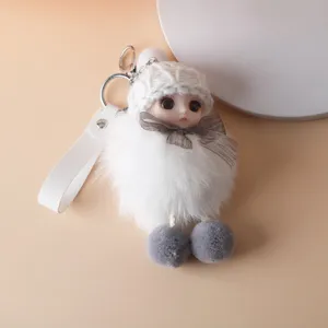 Cute white plush doll keychain charm with a knitted hat and grey mesh bow detail