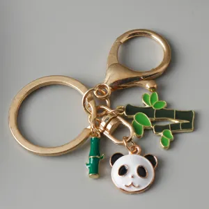 Detail shot of cute enamel panda keychain with bamboo charms and lobster clasp