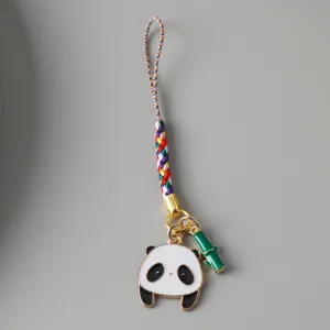 Detailed view of a cute enamel panda charm with bamboo detail on a colorful braided cord