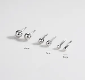 Close-up of minimalist sterling silver ball stud earrings in 2mm, 3mm, and 4mm sizes for daily.