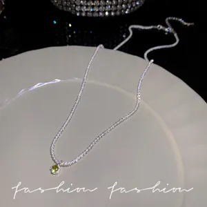 Sterling silver starlight necklace with green zircon detail shot, elegant and shining.