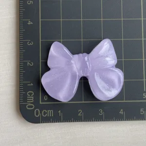 Grande fiocco in resina glitterata viola per fermagli per capelli e cover per telefoni.