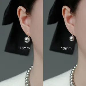 Grey pearl earrings detail showing 12mm and 10mm size options on model ear hook design.