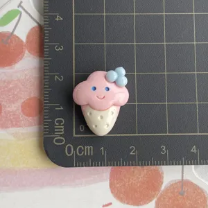 Resin ice cream cabochon detail view, cute smiling dessert charm for phone case DIY craft.