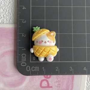 Cute resin pineapple cat DIY craft accessory, miniature charm for hair clips and phone cases.