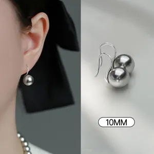 Exquisite grey pearl drop earrings detail showcasing smooth 10mm glossy round bead and hook.