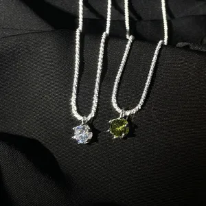 S925 sterling silver sparkling necklace with olive green and clear zirconia stone pendants.