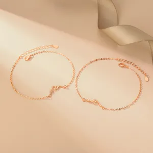 Detailed close-up shot of S925 sterling silver mountain and wave couple bracelets pair.
