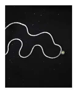 Detailed view of the sparkling S925 silver starlight chain featuring a green zircon pendant.