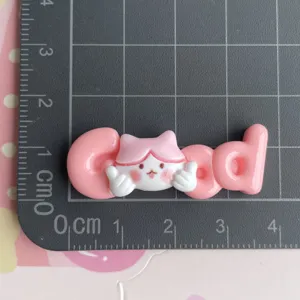 Cute cartoon letter resin charm flatback DIY crafting accessory for hair clips and phone cases.