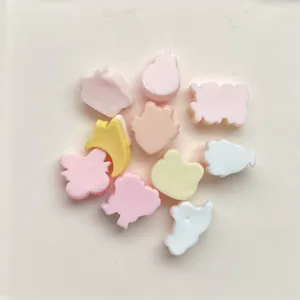 Resin cartoon DIY accessories detail view, cute pastel flatback charms for hair clips.