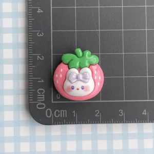 Cute glossy strawberry bunny resin cabochon detail, perfect for DIY crafts and decors.