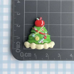 Resin Christmas tree charm detail view, perfect for DIY phone cases and hair clips decoration.