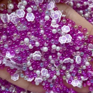 Mixed polymer clay cat paw and bubble beads for DIY slime charms and handmade jewelry making details