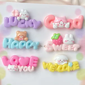 Detail shot of colorful resin cartoon alphabet accessories, cute rabbit bear DIY phone case charms.